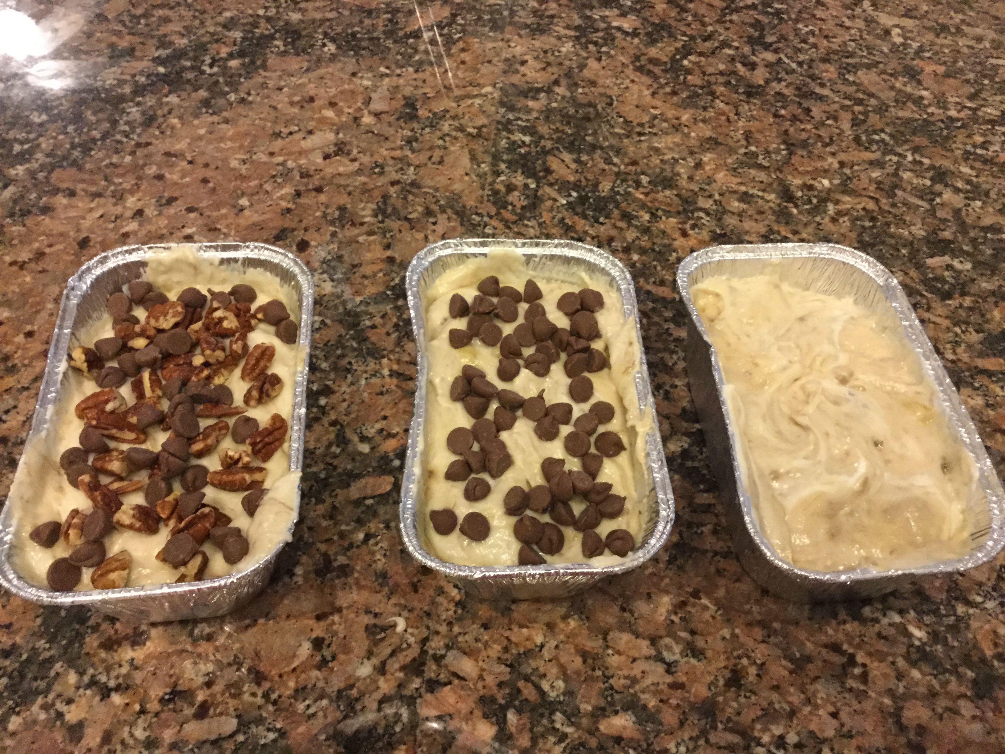 One loaf with pecans and chocolate chips, one with chocolate chips and one plain