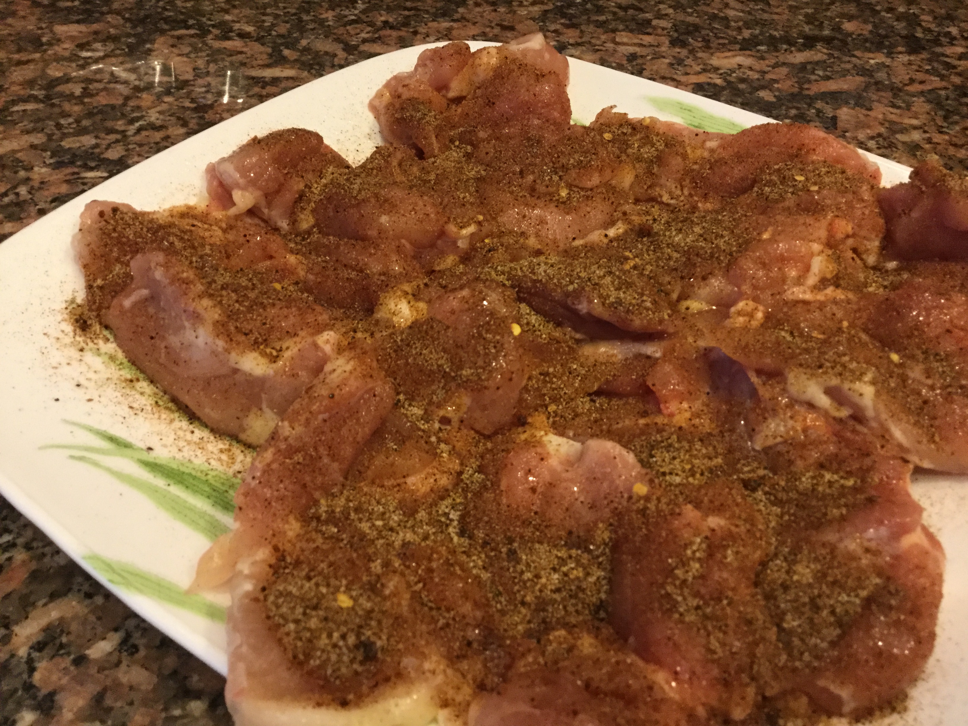 Chicken Covered with seasonings and ready for the grill